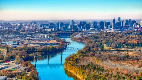The skyline of beautiful Nashville, Tennessee, in the distance along the banks of the Cumberland River