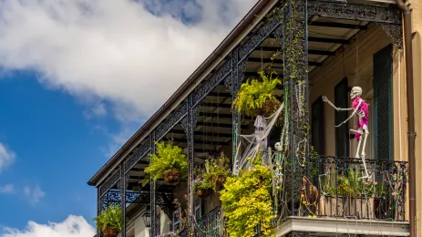 Halloween decorations on traditional New Orleans building in the French Quarter with wrought iron balconies