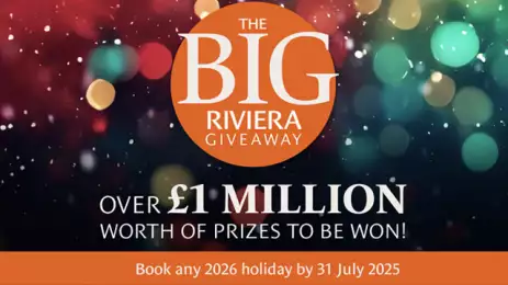 An orange circle with the words The Big Riviera Giveaway on it, with sparkling colours in the background