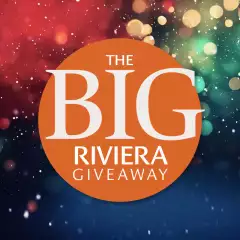 An orange circle with the words The Big Riviera Giveaway on it, with sparkling colours in the background