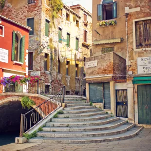 Side street of Venice with a bridge and old buildings
