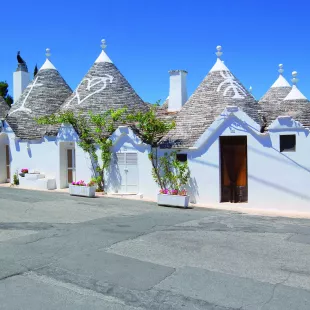 White houses with symbols in Alberobello, Puglia, Italy