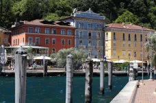 Exterior of the Hotel Europa, viewed from across port under bright daylight