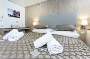 Close-up of towels on bed inside cabin aboard the MS Adriatic Sun ship