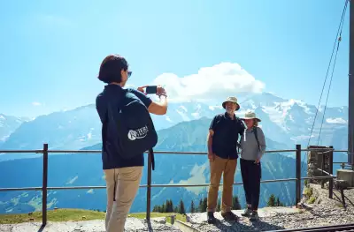 Riviera Tour Manager taking couples photo in Switzerland