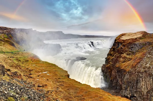 Rainbow arch in the sky above Gullfoss waterfall, Iceland