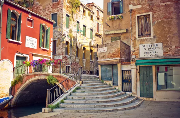 Side street of Venice with a bridge and old buildings