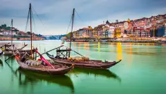 Porto cityscape on the Douro River with traditional Rabelo boats in Portugal